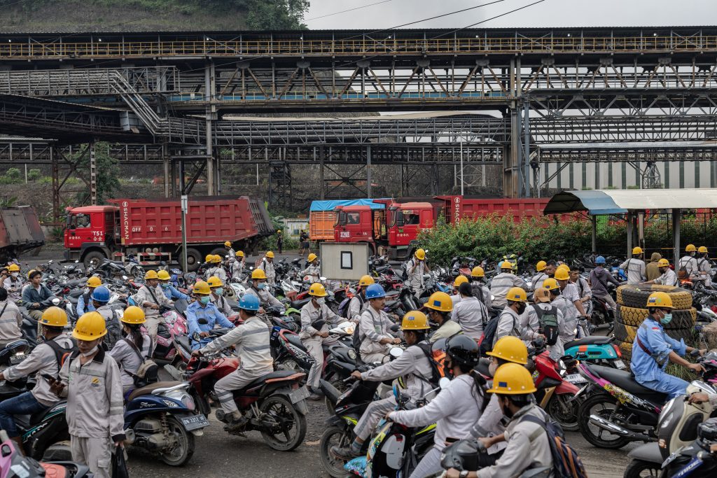 Employees in traffic during the working shift change near Indonesia Morowali Industrial Park (IMIP) on February 8, 2024, in Morowali, Central Sulawesi, Indonesia.